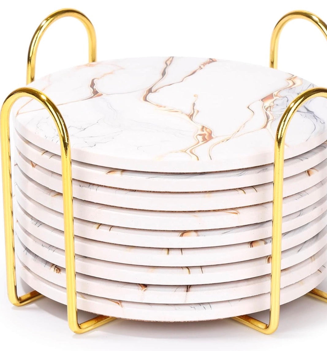 9 piece ceramic coaster set with a gold tone holder