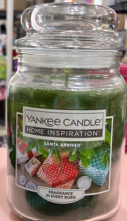 YANKEE CANDLE "Santa Arrived" scent, which blends balsam, pine, and eucalyptus.